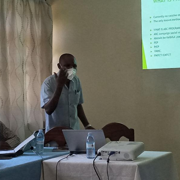 Dr. Maumbe talking to journalists during a science cafe