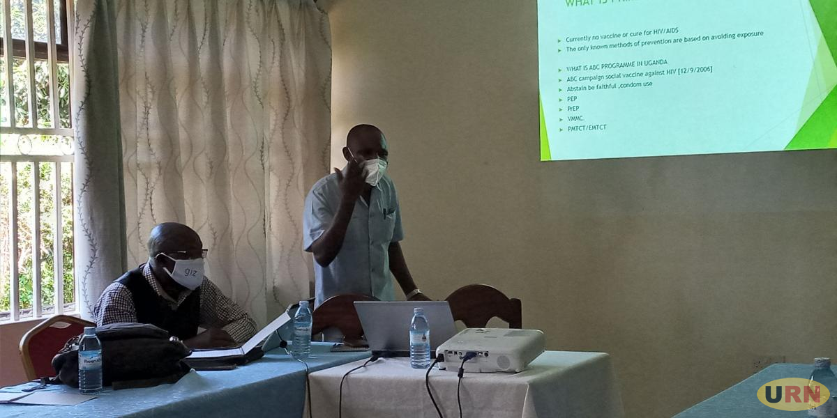 Dr. Maumbe talking to journalists during a science cafe