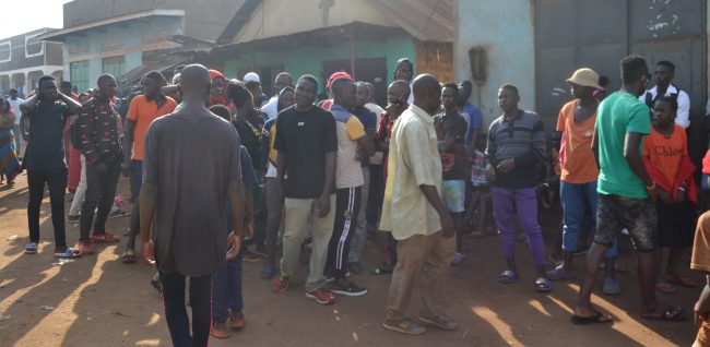Locals gathered at the scene of Isaac Ssenyange shot dead by soldiers in December last year