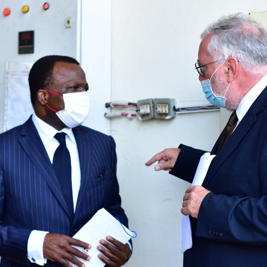 French ambassador Jules-Armand Aniambossou chats with Rudi Veestraeten, the Ambassador of Belgium to Uganda before handing over the doses to the Ugandan government.