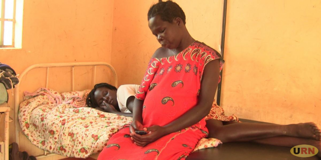 A mother with her daughter admitted at Kitamiiro Health Centre IV in Buvuna District