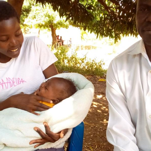 Winnie Aculo with her father, Albert Okello at the rented house where Aculo stays as she studies at Soroti SS.