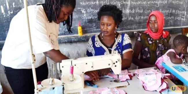 Women sewing reusable sanitary pads during the training